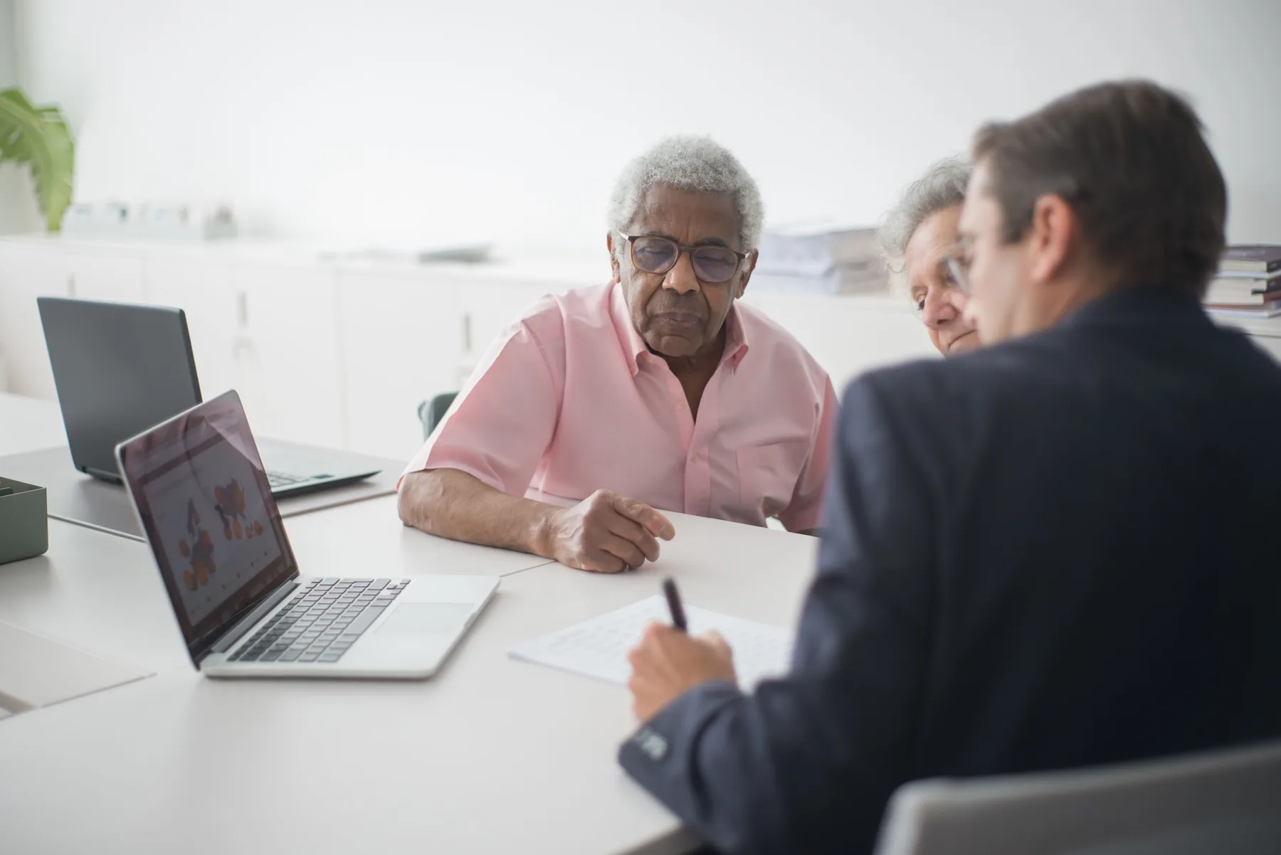 Older couple meeting with an insurance advisor